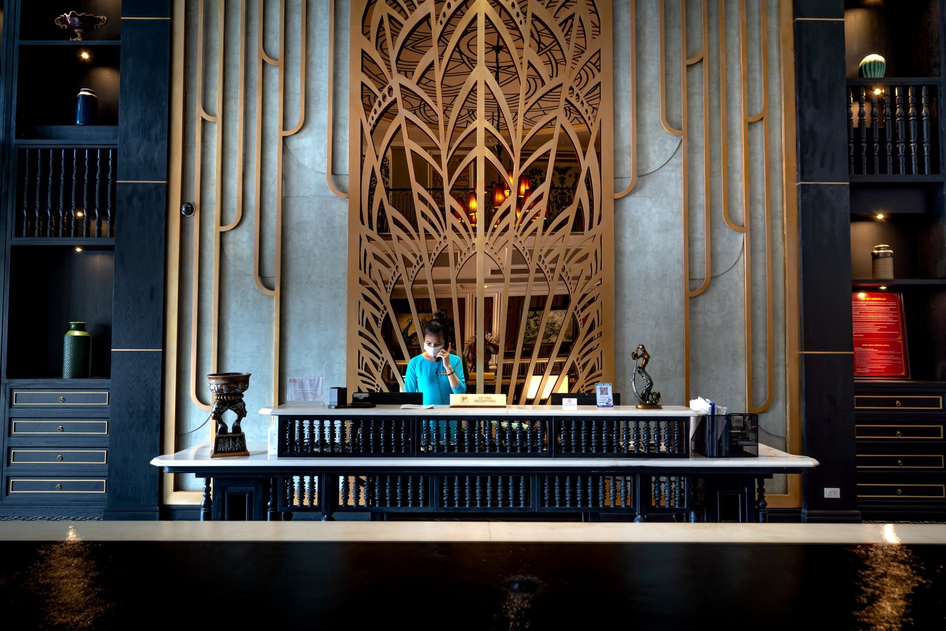 Hospitality reception desk environment with professional training in progress